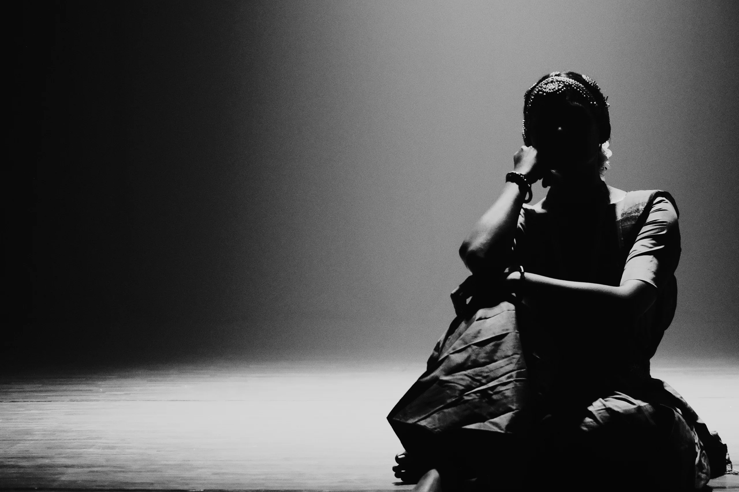 A Bharatanatyam dancer holds still between two movements, on the beat with no sound, which is the hardest one in any composition.