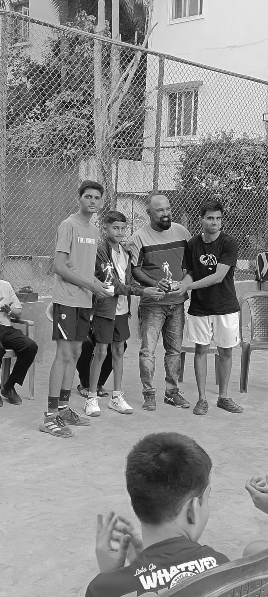 Receiving the doubles runner-up trophy