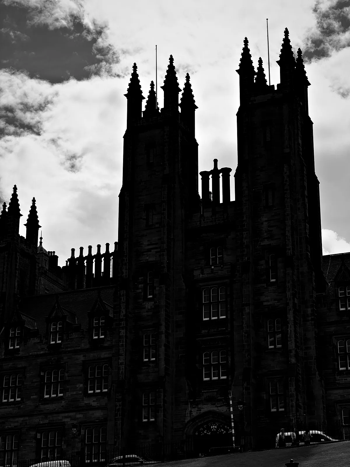The towers of New College in silhouette above the Mound