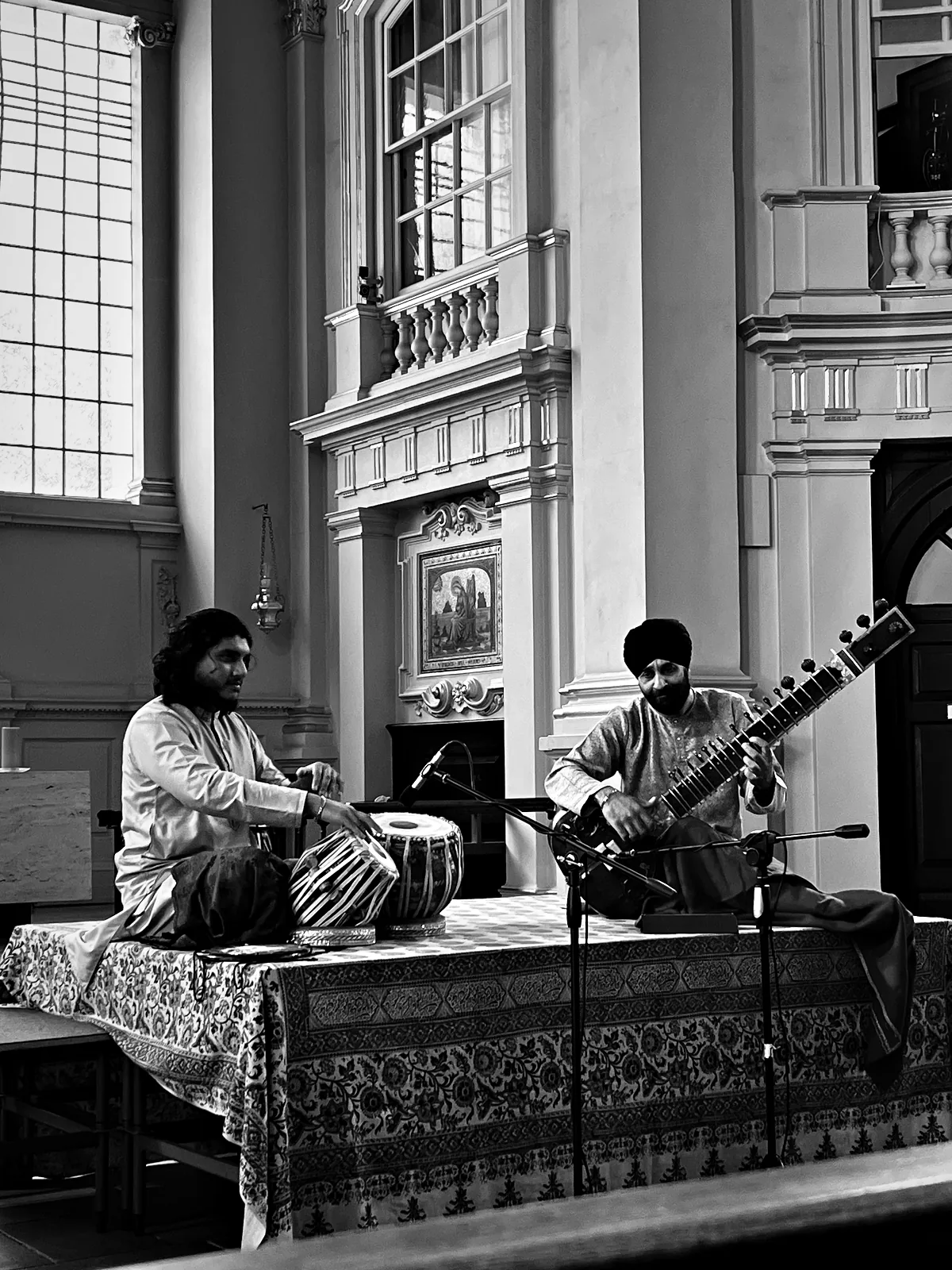 Junaid Ali on tabla and Harmeet Virdee on sitar, on the stage at St Martin-in-the-Fields