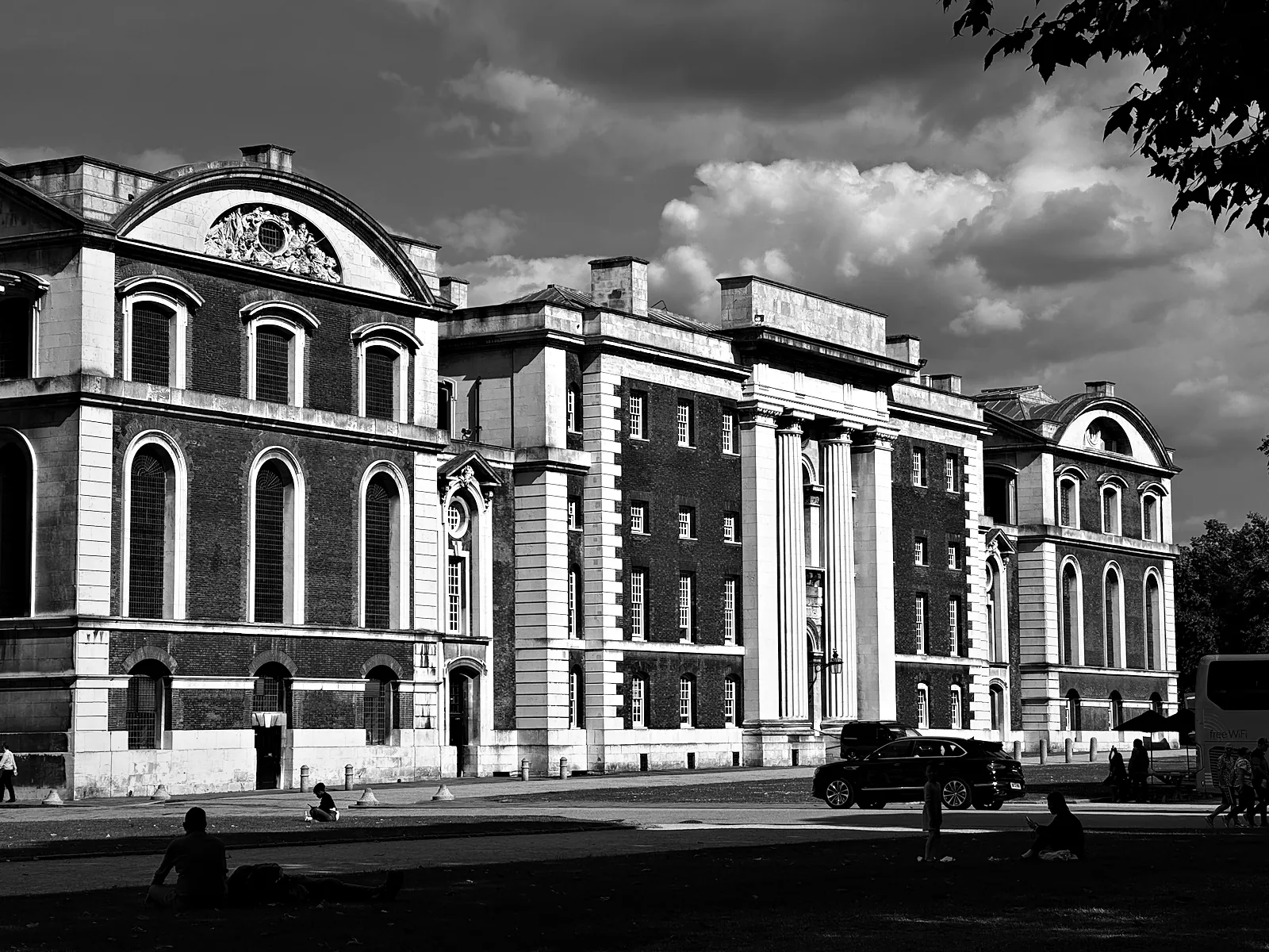 Brick and stone ranges of the Old Royal Naval College at Greenwich under a big sky
