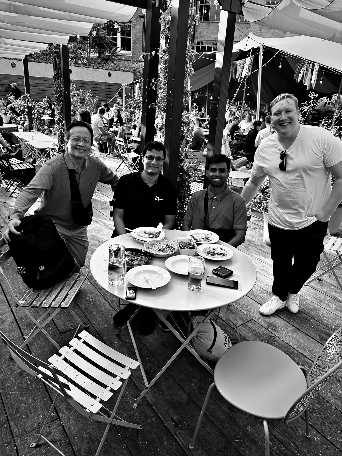 Viren and me at an outdoor table over dinner with our AMD colleagues Ning and Harry