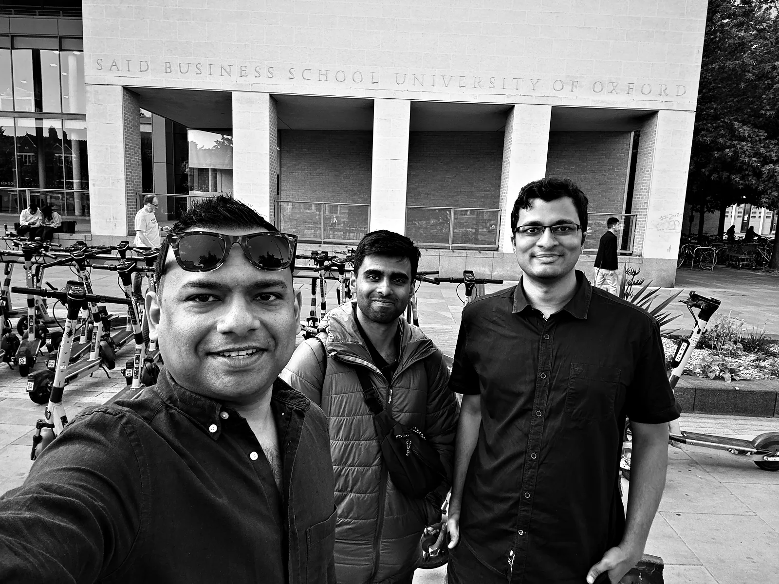 Viren's cousin, me and Viren in a selfie in front of the Saïd Business School beside Oxford station