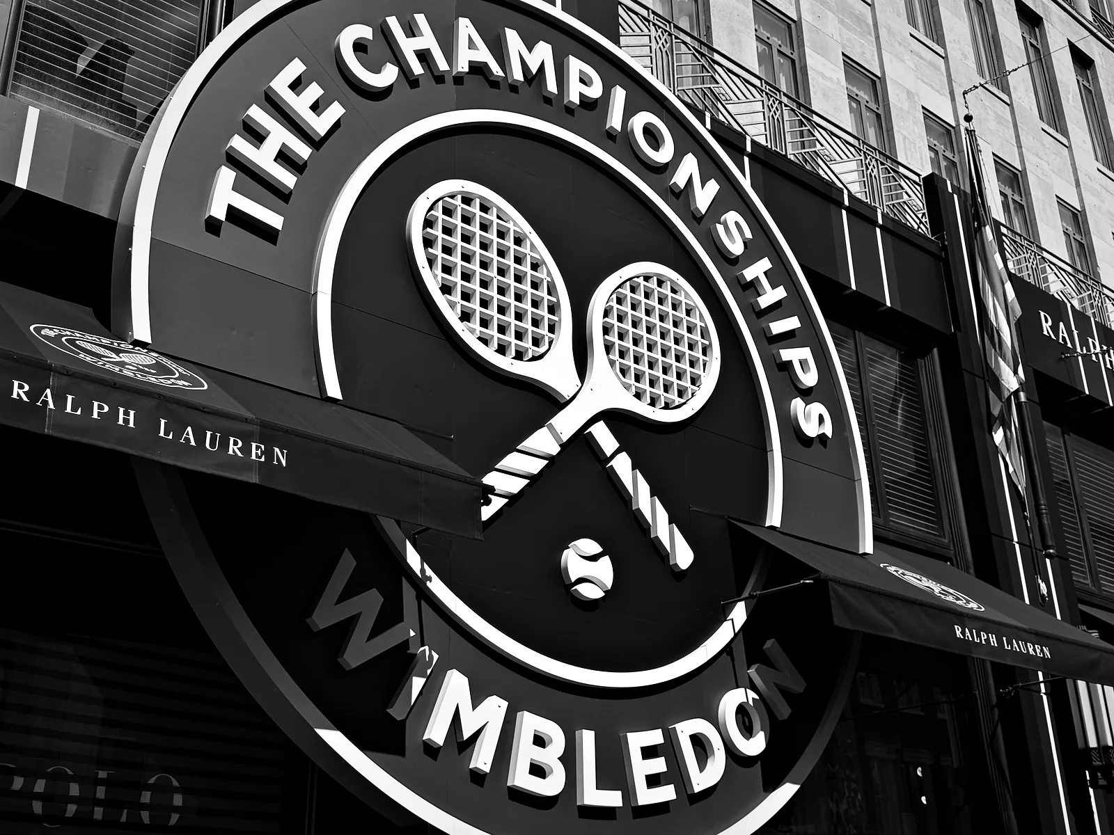 A giant Championships Wimbledon crest over a shopfront in Mayfair